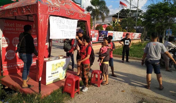 Telkomsel bergerak cepat dalam waktu kurang dari 24 jam memobilisasi genset untuk catuan daya serta memasang mobile BTS.Foto/Dok-Telkomsel/ECONOMICZONE